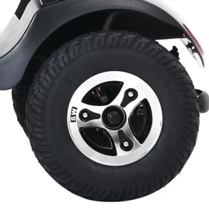 Close-up of a vehicle's rear tire with a sporty rim design.