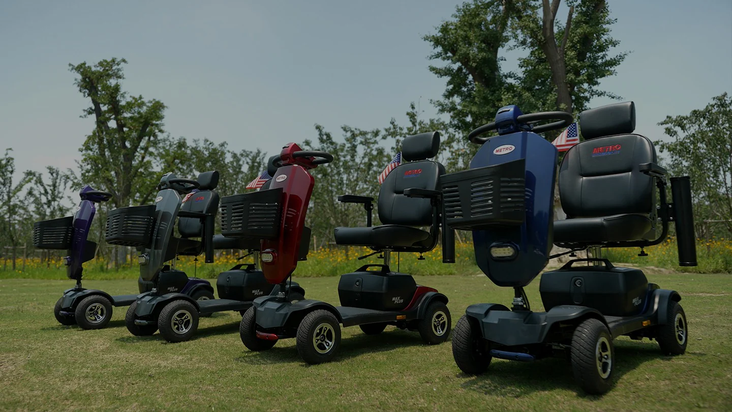 Row of colorful mobility scooters parked on grass