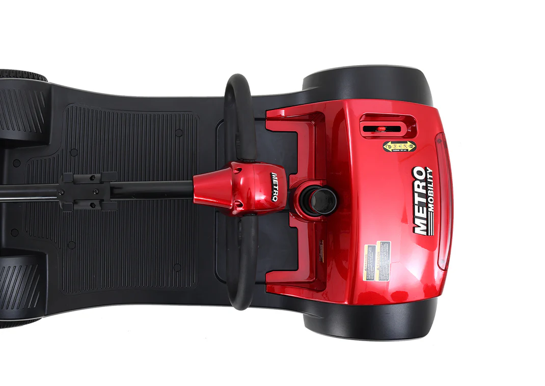 Red Metro vacuum cleaner with black dust bag.